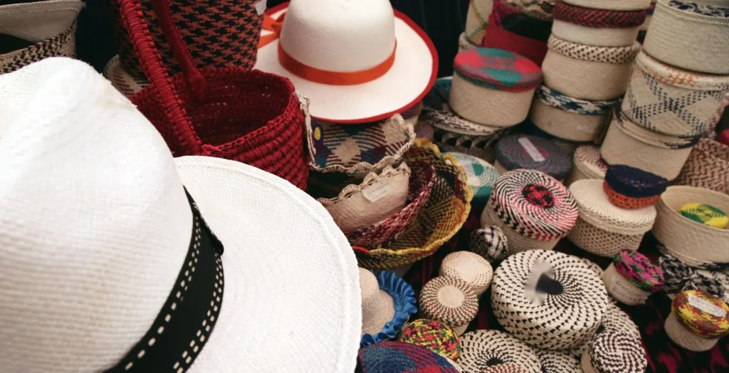 Toquilla straw hats and woven pieces on a craft fair stall
