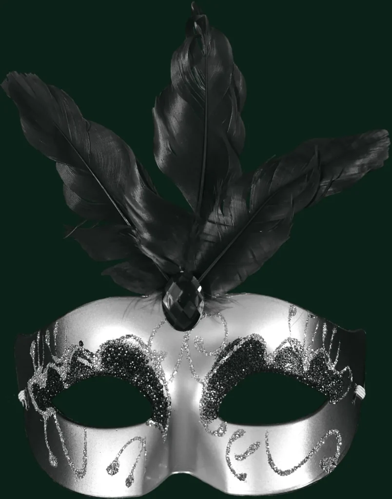 A silver masquerade mask with black feathers on a dark green background